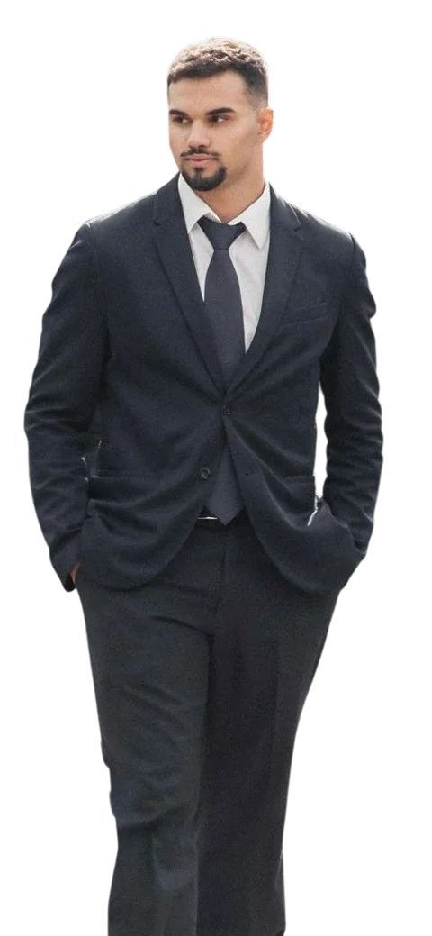 Diogo Pinto in a dark suit, walking